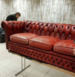 Faded Chesterfield sofa